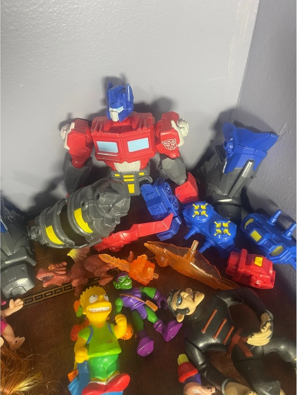 Mixed Lot of Vintage and Modern Action Figures Including Transformers, Simpsons,